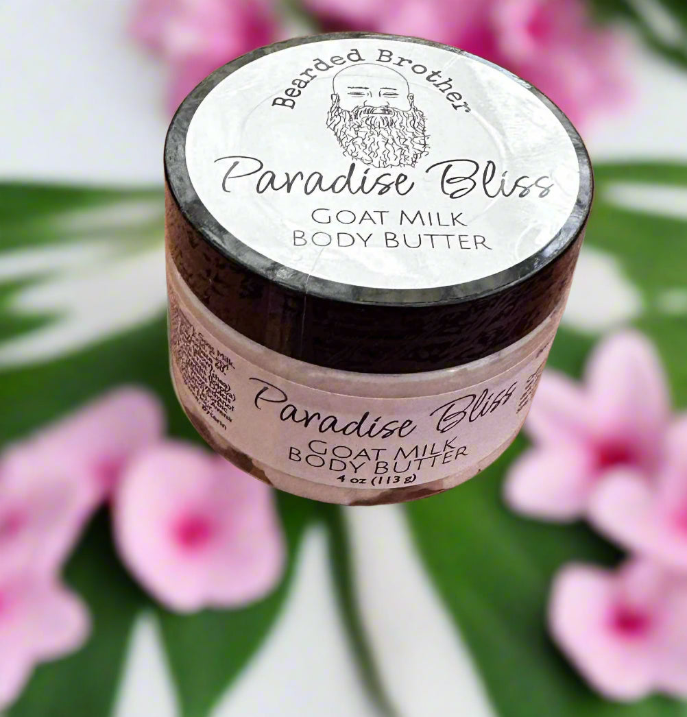 Jar of Paradise Bliss Goat Milk Body Butter on a wooden surface